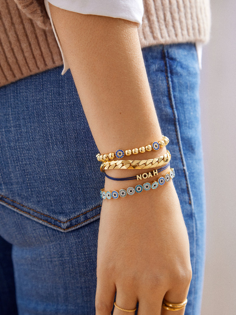 BaubleBar Isabella Bracelet - Blue/Gold - 
    Gold evil eye stretch bracelet
  
