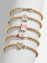BaubleBar Baker's Choice Kids' Pisa Bracelet Set - Cupcake - 
    Five gold beaded stretch bracelets
  
