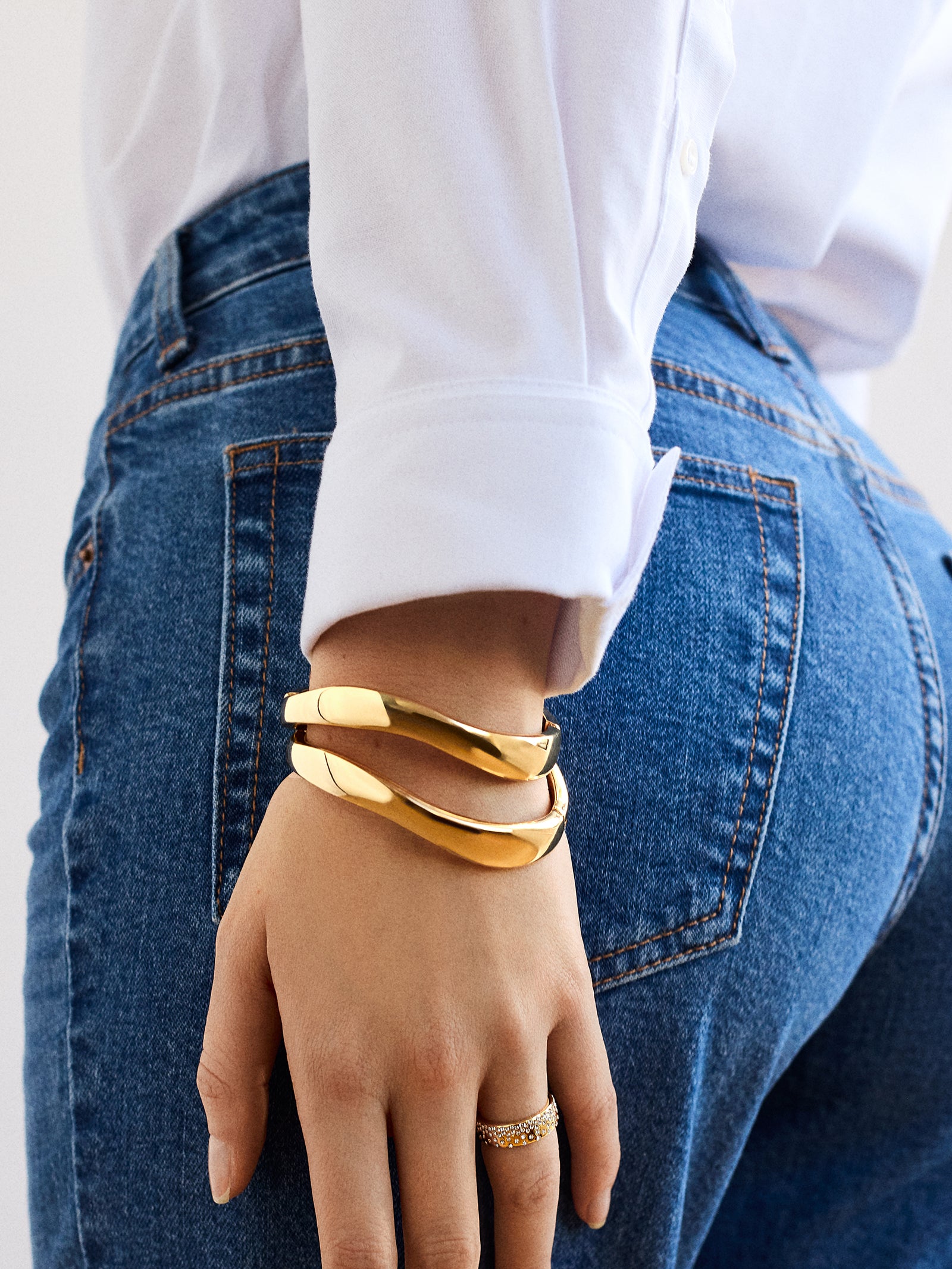Natalia Wavy Hinge Bangle Set - Gold – 2 gold wave bangles – BaubleBar