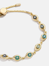 BaubleBar Aisha Evil Eye Bracelet - Gold/Blue - 
    Evil eye pull-tie tennis bracelet 
  
