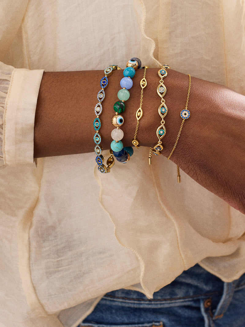 BaubleBar Aisha Evil Eye Bracelet - Gold/Blue - 
    Evil eye pull-tie tennis bracelet 
  
