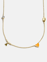 BaubleBar University of Tennessee Spaced Charm Necklace - University of Tennessee - 
    Gold necklace with University of Tennessee charms
  
