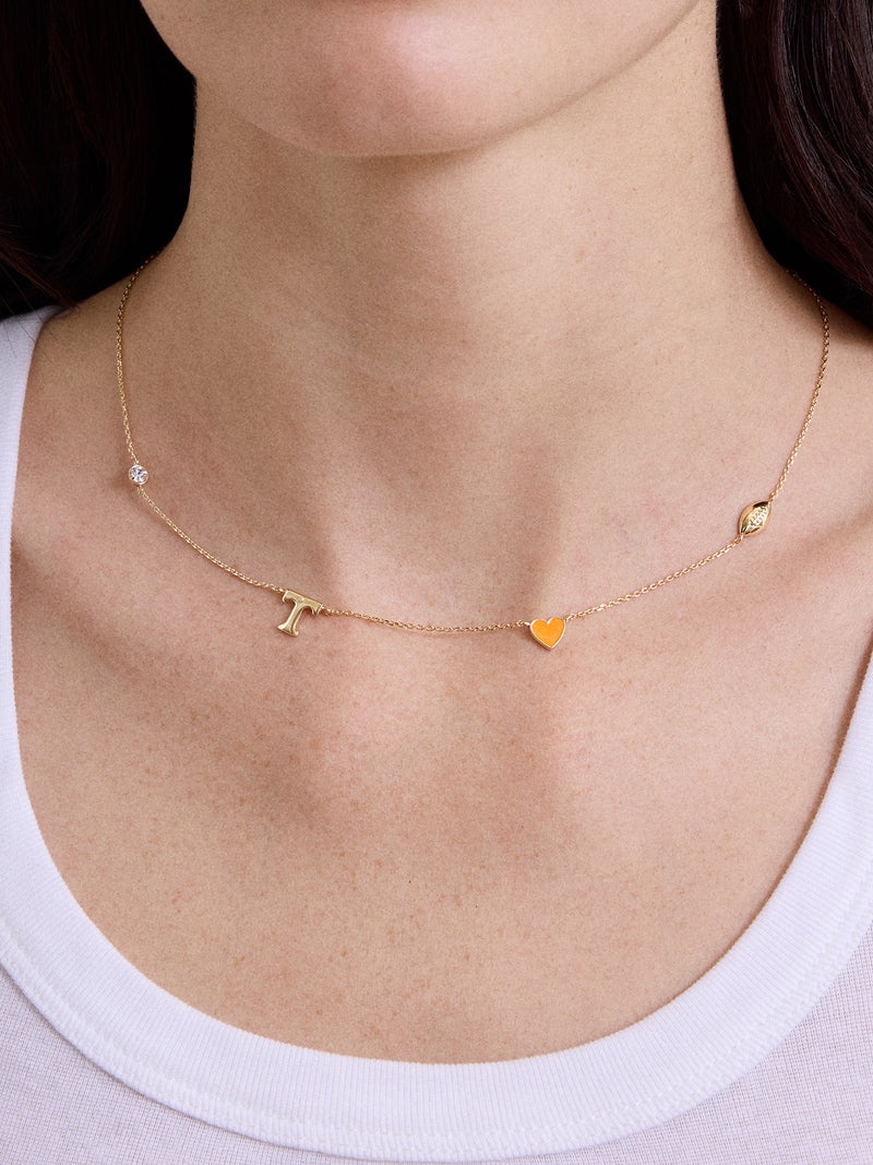 BaubleBar University of Tennessee Spaced Charm Necklace - University of Tennessee - 
    Gold necklace with University of Tennessee charms
  
