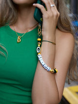 BaubleBar  - 
    Hands-free wristlet phone strap 
  
