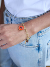 BaubleBar NFL Charm Bracelet - Cincinnati Bengals - 
    Gold bracelet with charms
  
