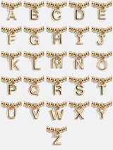 BaubleBar Dangle Charm Initial Pisa Bracelet - Gold - 
    Beaded bracelet for stacking 
  
