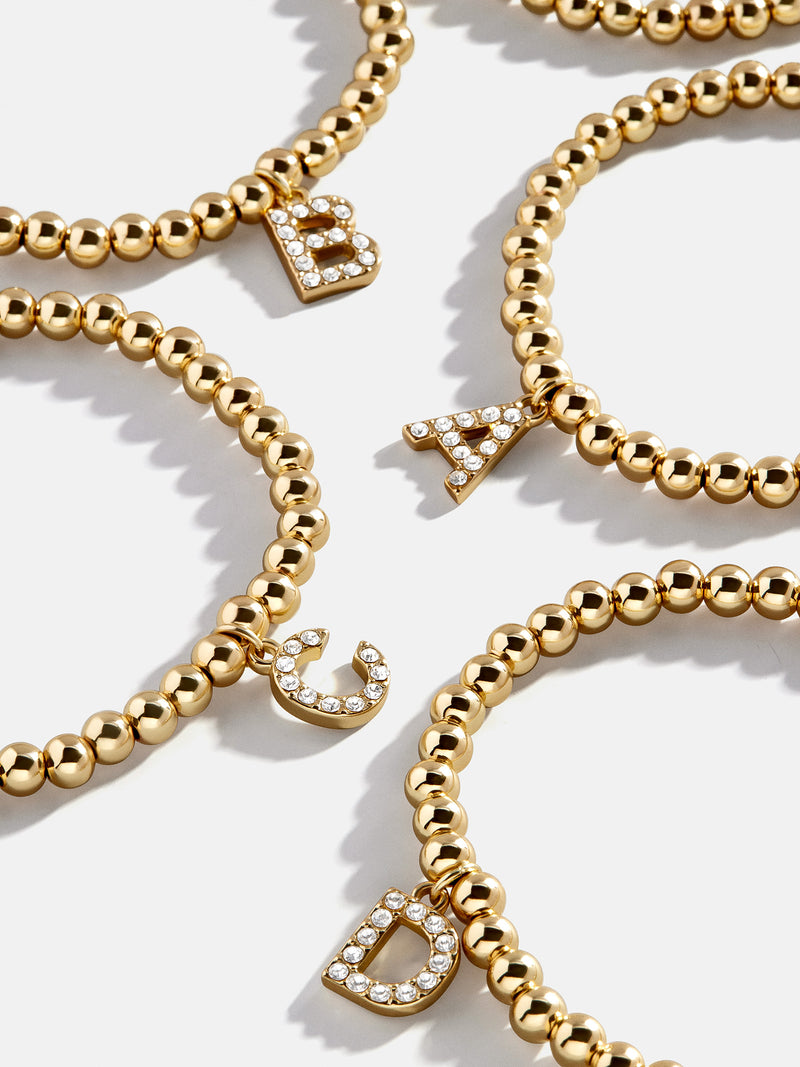 BaubleBar Dangle Charm Initial Pisa Bracelet - Gold/Pavé - 
    Beaded bracelet for stacking 
  
