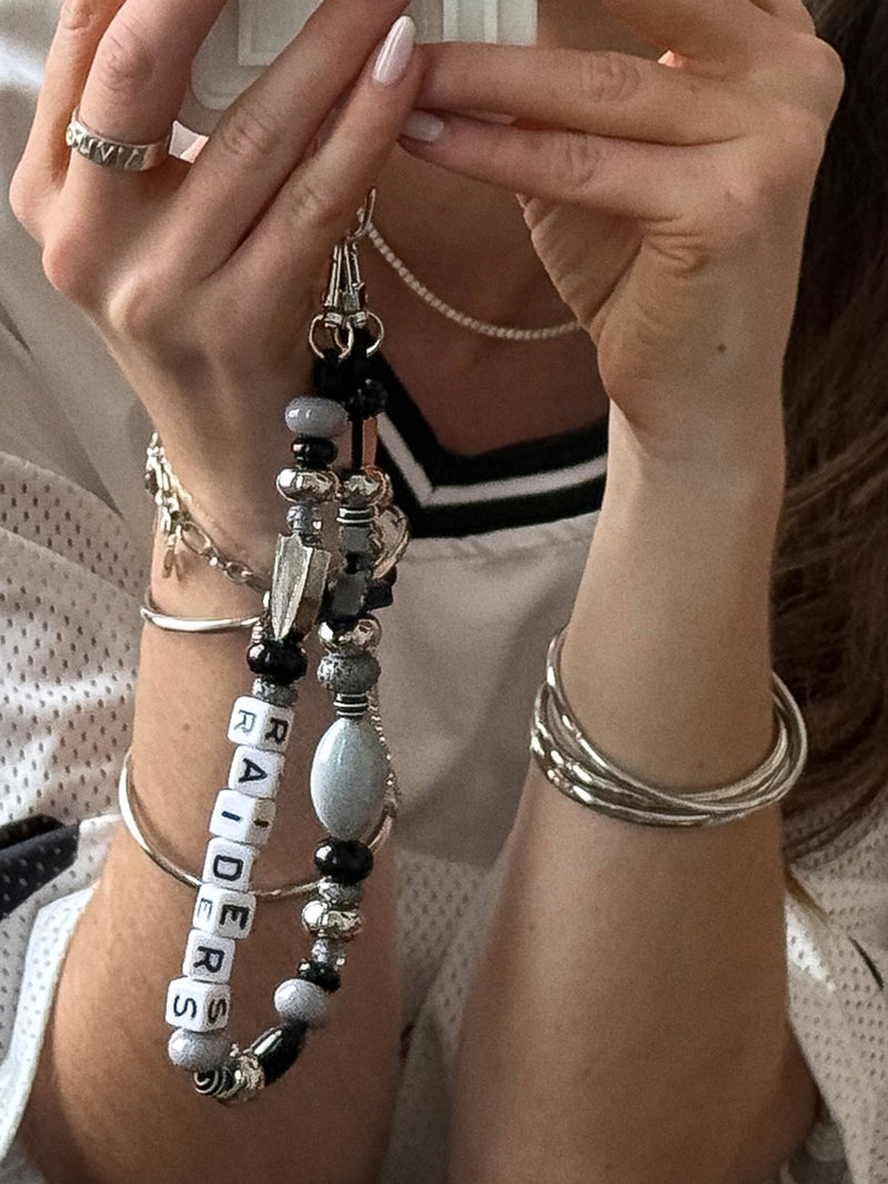 BaubleBar NFL Beaded Phone Charm - Las Vegas Raiders - 
    Hands-free wristlet phone strap
  
