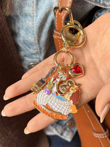 BaubleBar Disney Lady and the Tramp Dynamic Duo Bag Charm - Disney Lady & the Tramp - 
    Gold keychain with Disney charms 
  
