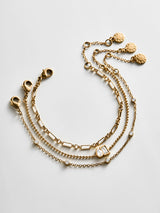 BaubleBar Cosette Waterproof Bracelet Set - Cosette Waterproof Bracelet Set - 
    Set of three gold bracelets 
  
