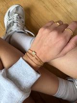 BaubleBar Cosette Waterproof Bracelet Set - Cosette Waterproof Bracelet Set - 
    Set of three gold bracelets 
  
