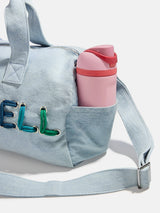 BaubleBar Thready to Go Kids’ Custom Duffle - Light Denim/Pink Multi - 
    Personalized travel bag 
  
