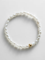 BaubleBar Ginnie Pearl Bracelet - Single Gold - 
    Beaded stretch bracelet for stacking 
  
