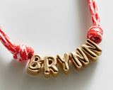 BaubleBar Bubble Letter Custom Paracord Necklace - Red/White - 
    Custom Name Necklace


  

