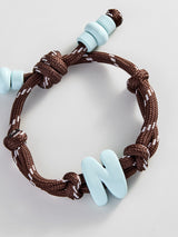 BaubleBar Knotty Enamel Initial Custom Bracelet - Brown/Blue Single Letter - 
    Ends Friday: Enjoy 20% Off 
  

