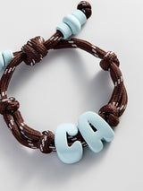 BaubleBar Knotty Enamel Initial Custom Bracelet - Brown/Blue Double Letter - 
    Personalized letter bracelet

  
