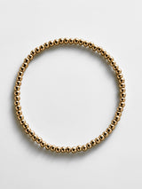 BaubleBar Gold Pisa Bracelet - 3MM Beads - 
    Gold beaded stretch bracelet 
  
