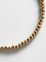 BaubleBar Gold Pisa Bracelet - 3MM Beads - 
    Gold beaded stretch bracelet 
  
