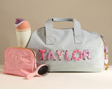 BaubleBar  - 
    Personalized travel bag 
  
