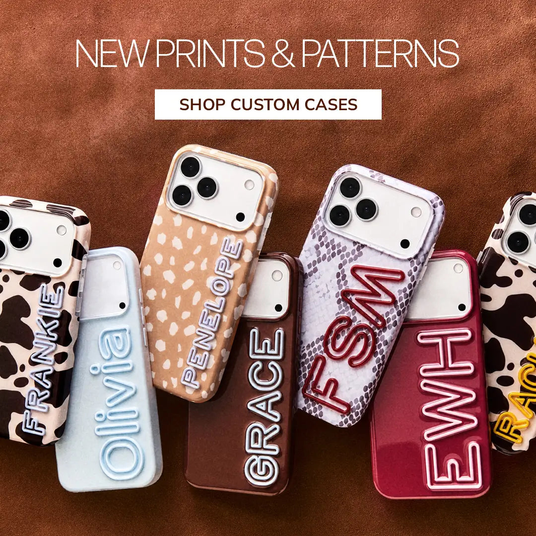 Phone cases in cow, animal and snake prints with raised name lettering, including “FRANKIE,” “Olivia” and “GRACE.” Text reads “New Prints & Patterns.” Button: “Shop Custom Cases.”