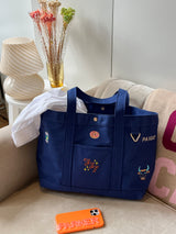 BaubleBar Navy - 
    Hand select 5 icons to personalize your tote
  
