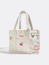 BaubleBar  - 
    Hand select 5 icons to personalize your tote
  
