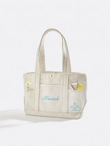BaubleBar  - 
    Hand select 4 icons to personalize your tote
  
