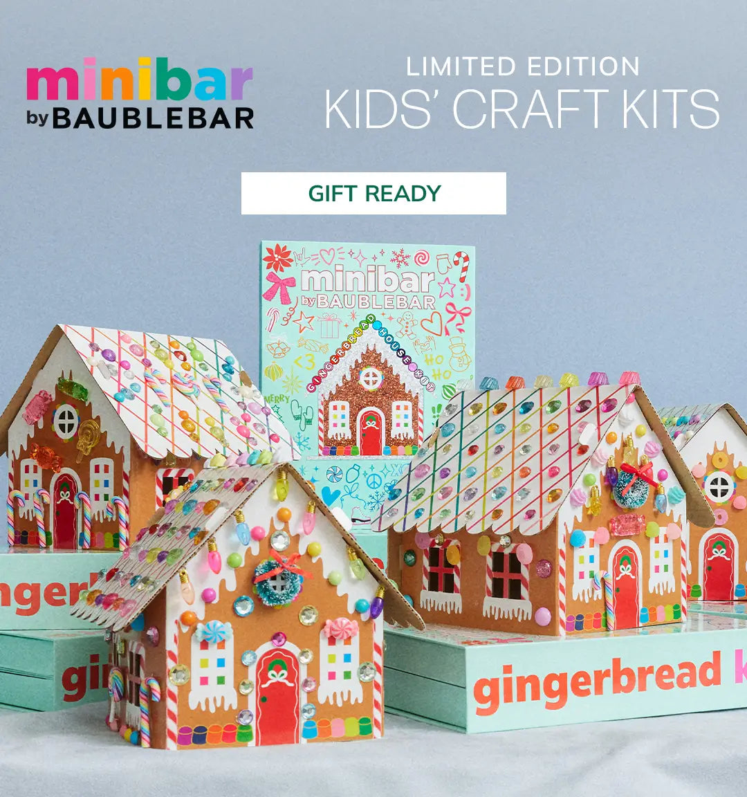 Decorated gingerbread house craft kits beside mint green boxes labeled “gingerbread kit.” Text reads “minibar by BaubleBar. Limited Edition Kids’ Craft Kits.” Button: “Gift Ready.”