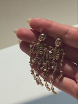 BaubleBar Drop Dead Hottie Earrings - Gold - 
    Statement skeleton Halloween earrings 
  
