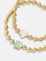 BaubleBar Initial & Heart Kids' Pisa Bracelet Set - Gold - 
    Set of two stretch bracelets
  
