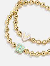 BaubleBar Initial & Heart Kids' Pisa Bracelet Set - Initial & Heart - 
    Two kids' gold beaded stretch bracelets
  
