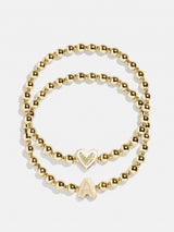 BaubleBar A - 
    Two kids' gold beaded stretch bracelets
  
