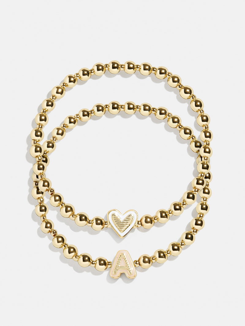 BaubleBar A - 
    Two kids' gold beaded stretch bracelets
  
