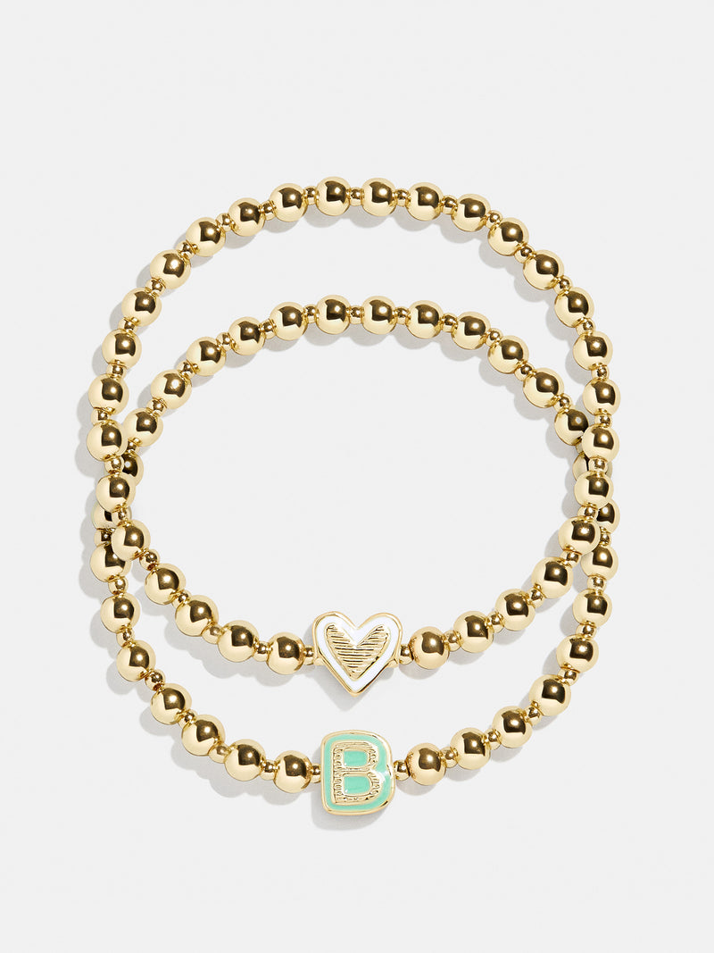 BaubleBar B - 
    Two kids' gold beaded stretch bracelets
  
