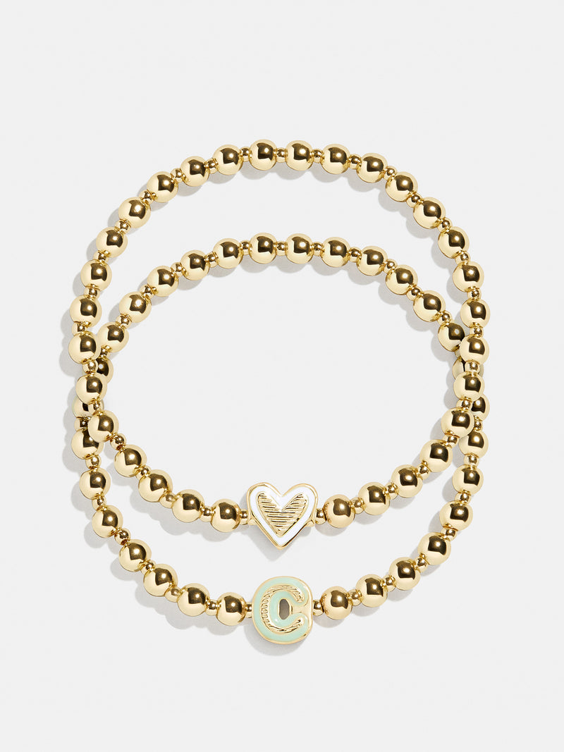 BaubleBar C - 
    Two kids' gold beaded stretch bracelets
  
