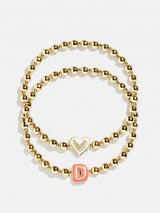 BaubleBar D - 
    Two kids' gold beaded stretch bracelets
  
