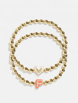 BaubleBar F - 
    Two kids' gold beaded stretch bracelets
  
