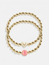 BaubleBar Initial & Heart Kids' Pisa Bracelet Set - Initial & Heart - 
    Two kids' gold beaded stretch bracelets
  
