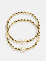 BaubleBar H - 
    Two kids' gold beaded stretch bracelets
  
