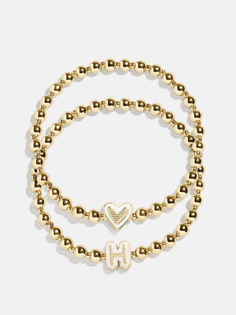 BaubleBar H - 
    Two kids' gold beaded stretch bracelets
  
