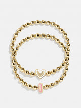 BaubleBar I - 
    Two kids' gold beaded stretch bracelets
  
