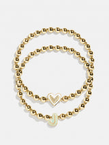 BaubleBar J - 
    Two kids' gold beaded stretch bracelets
  
