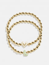 BaubleBar L - 
    Two kids' gold beaded stretch bracelets
  
