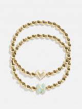 BaubleBar N - 
    Two kids' gold beaded stretch bracelets
  
