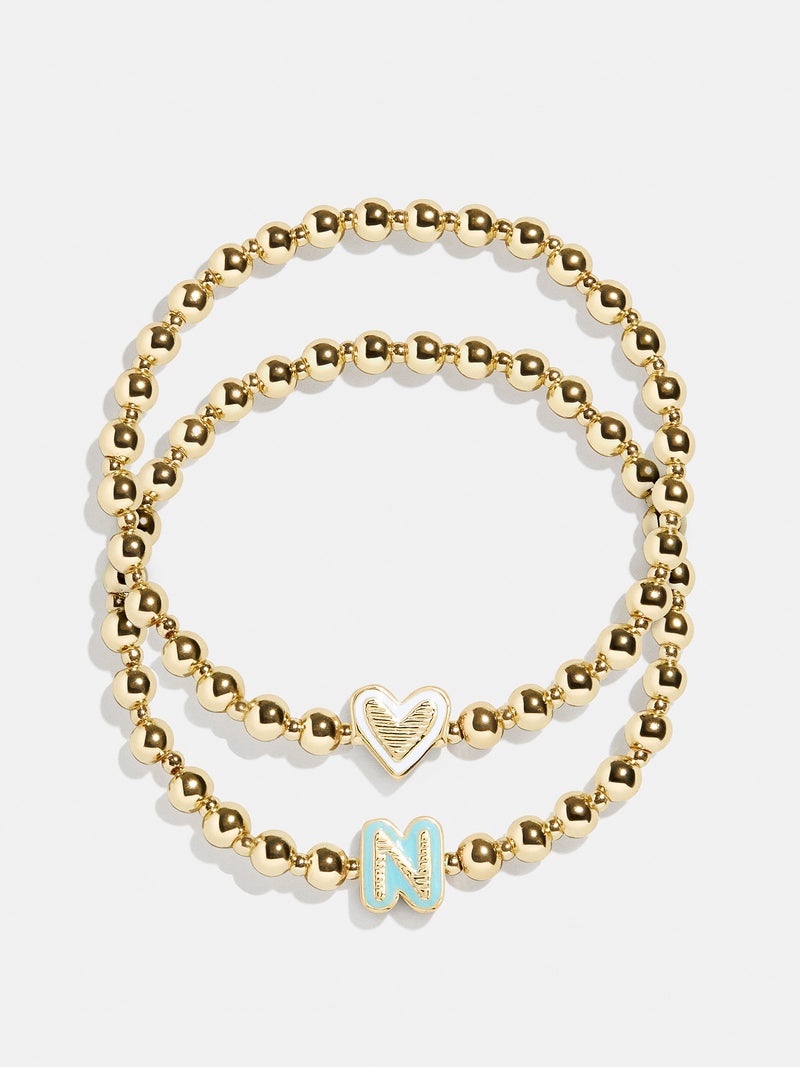 BaubleBar N - 
    Two kids' gold beaded stretch bracelets
  
