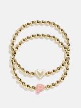 BaubleBar P - 
    Two kids' gold beaded stretch bracelets
  
