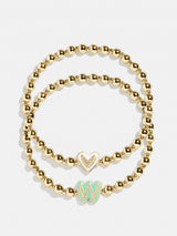 BaubleBar W - 
    Two kids' gold beaded stretch bracelets
  
