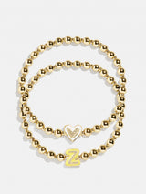 BaubleBar Z - 
    Two kids' gold beaded stretch bracelets
  
