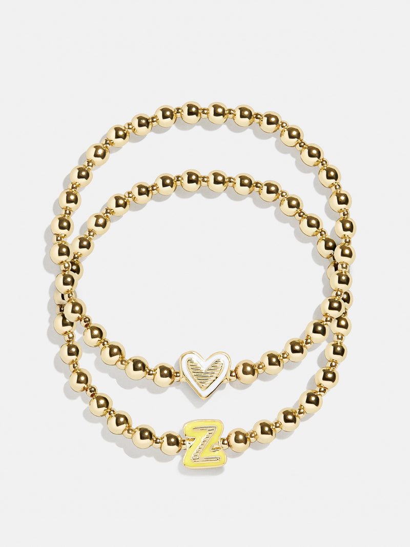 BaubleBar Z - 
    Two kids' gold beaded stretch bracelets
  
