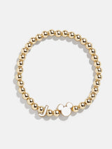 BaubleBar J - 
    Disney gold beaded stretch bracelet
  
